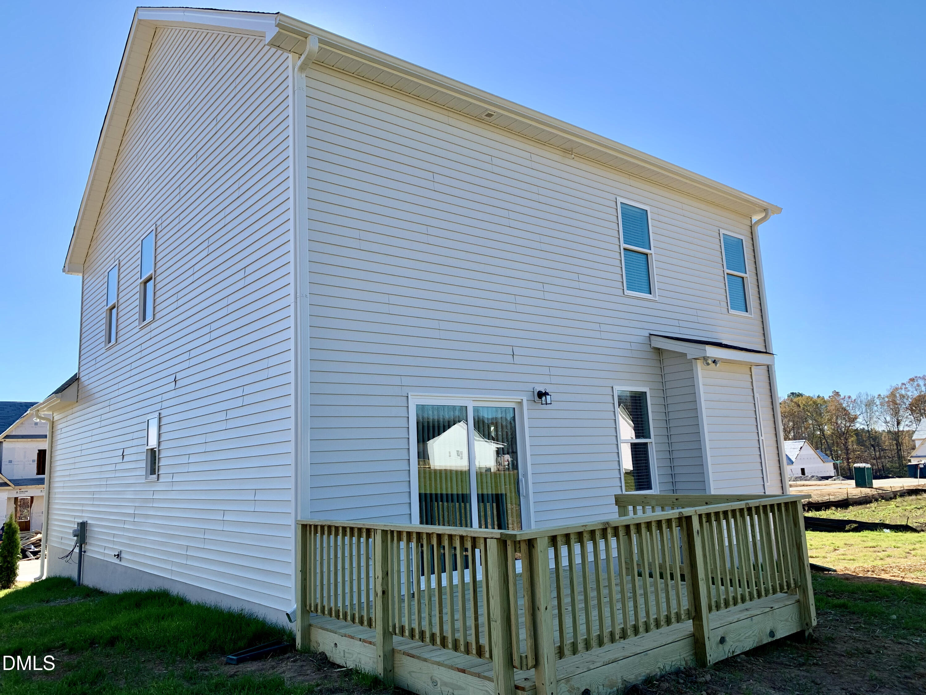 48 Weathervane Dr. Zebulon, NC 27597 - Photo 20 of 24 a front view of a house with a garden