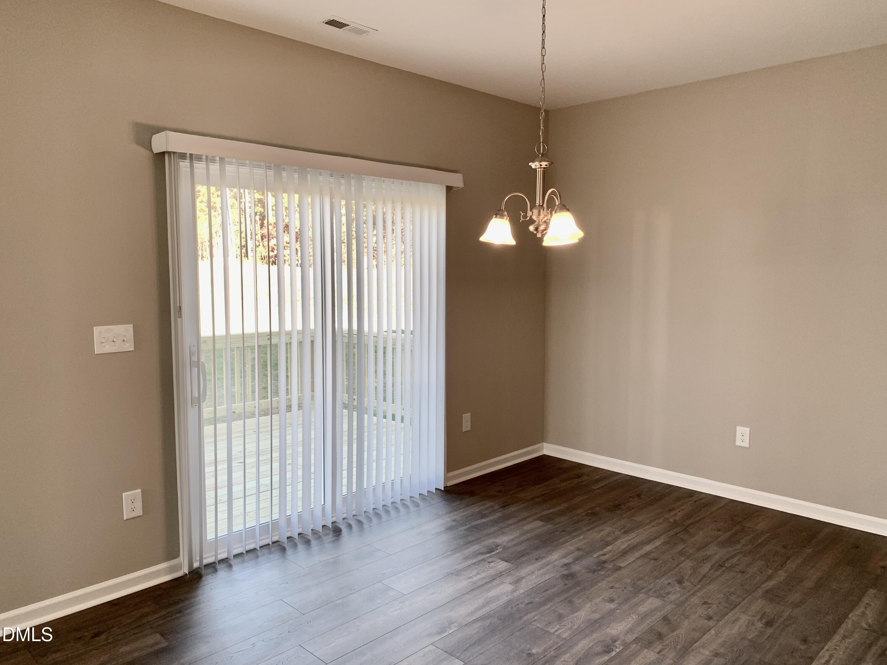 48 Weathervane Dr. Zebulon, NC 27597 - Photo 5 of 24 a view of a room with wooden floor and fan