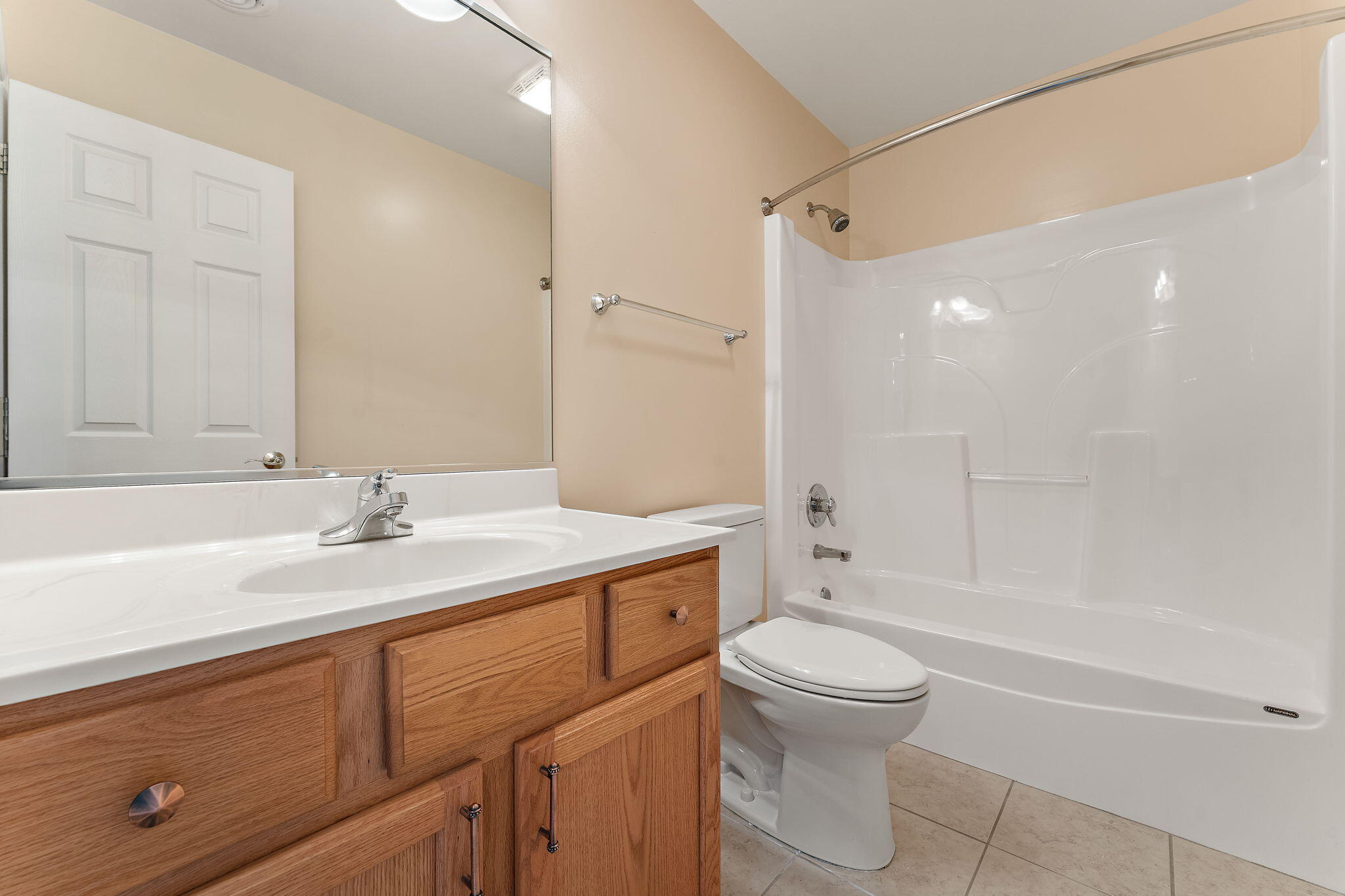 901 Veterans Lane Crown Point, IN 46307 - Photo 21 of 40 a bathroom with a sink a toilet and a large mirror