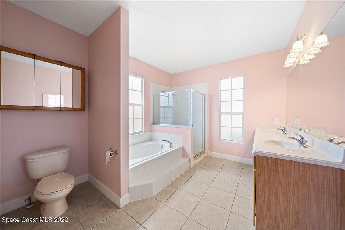 320 Pebble Hill Way Rockledge, FL 32955 - Photo 15 of 27 a spacious bathroom with a toilet sink and a bathtub