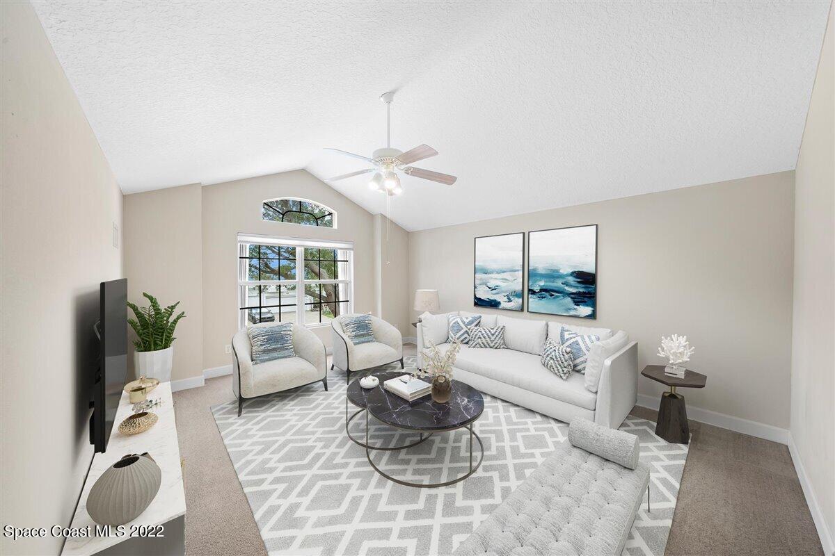 320 Pebble Hill Way Rockledge, FL 32955 - Photo 20 of 27 a living room with furniture and a large window