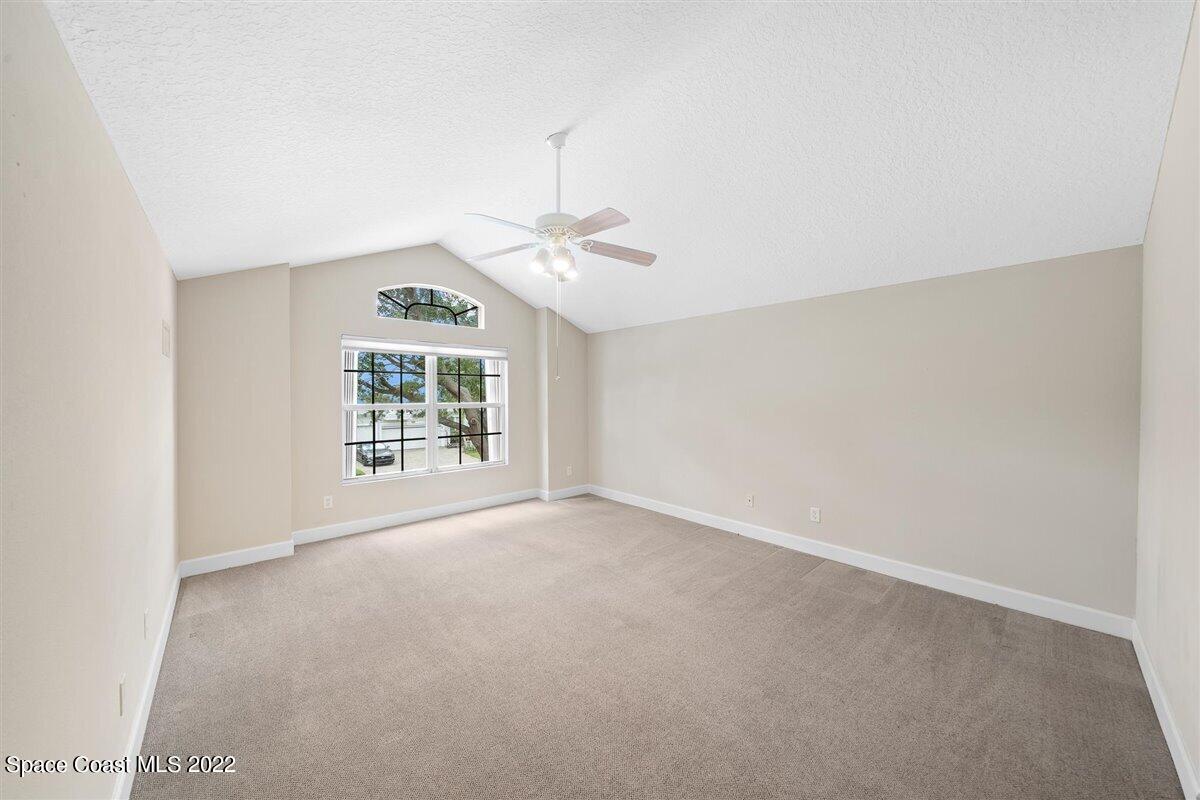 320 Pebble Hill Way Rockledge, FL 32955 - Photo 21 of 27 an empty room with windows and fan