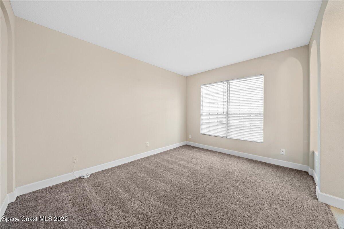 320 Pebble Hill Way Rockledge, FL 32955 - Photo 6 of 27 an empty room with a empty space and a window