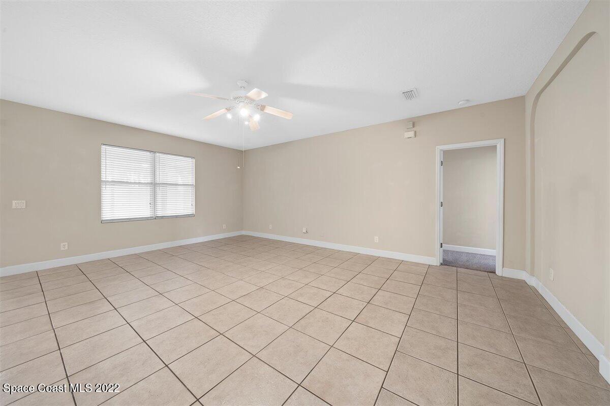 320 Pebble Hill Way Rockledge, FL 32955 - Photo 10 of 27 a view of an empty room and window