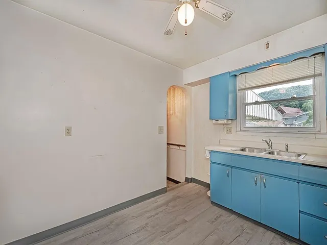 a view of two sink and a refrigerator