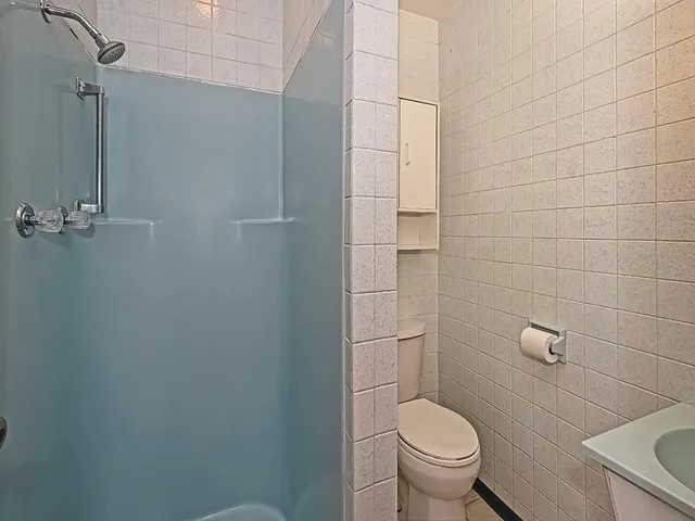 a bathroom with a toilet and a sink