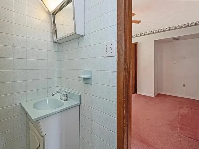 a bathroom with a bathtub and shower