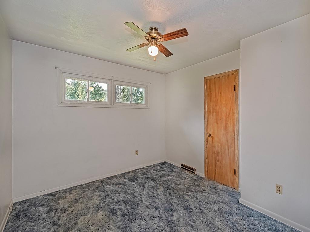 2488 Banks School Road Gibsonia, PA 15044 - Photo 19 of 31 a view of a livingroom with a ceiling fan and window