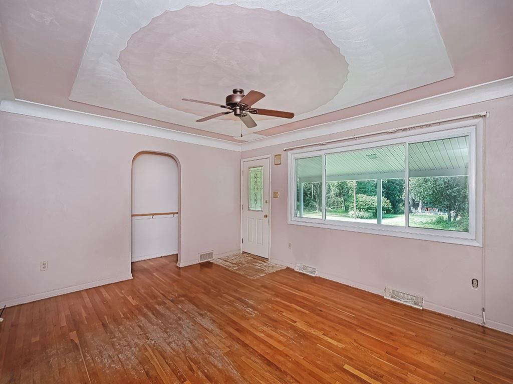 2488 Banks School Road Gibsonia, PA 15044 - Photo 6 of 31 a view of a livingroom with wooden floor and a ceiling fan