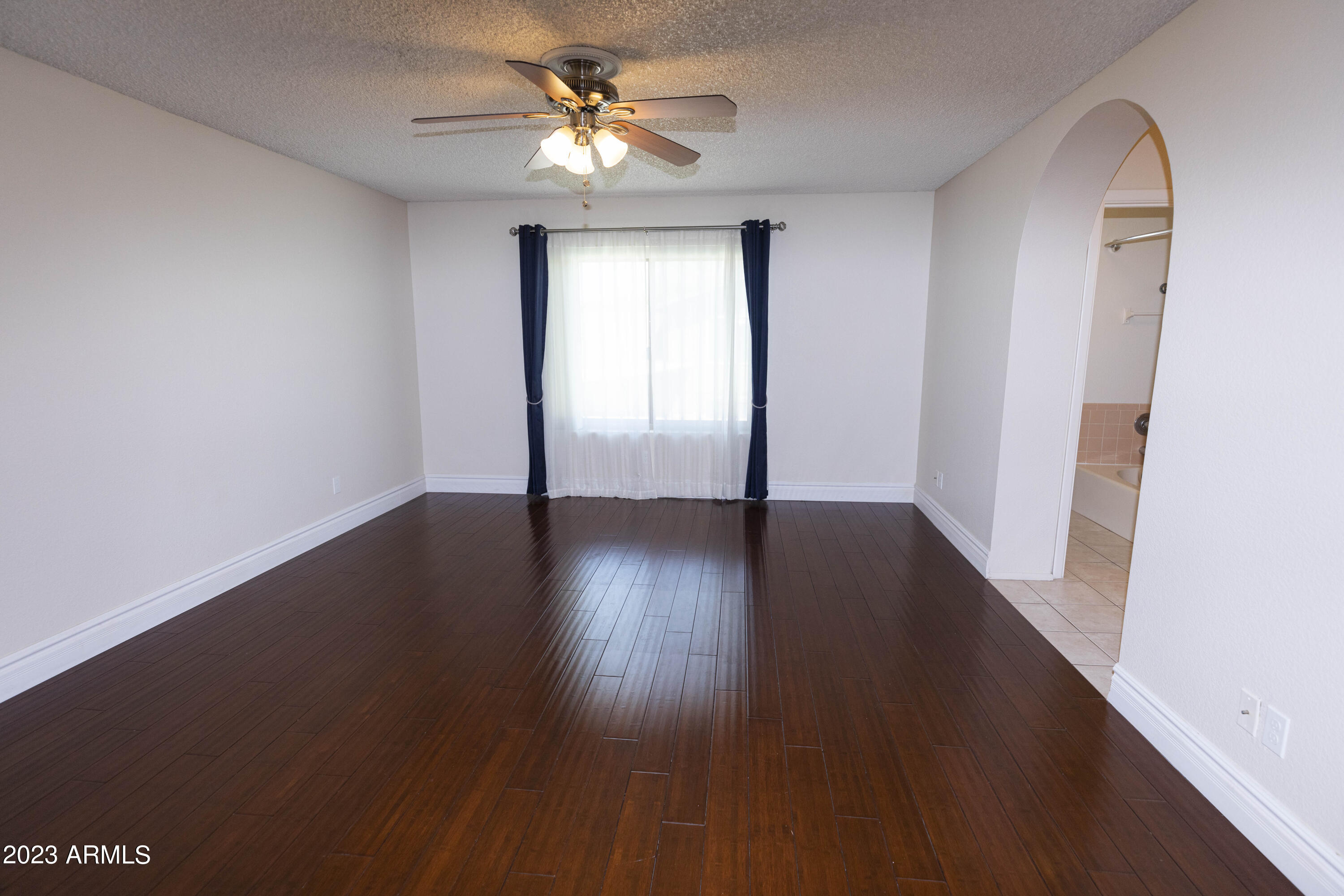 608 East Appaloosa Road Gilbert, AZ 85296 - Photo 11 of 38 wooden floor in an empty room with a window