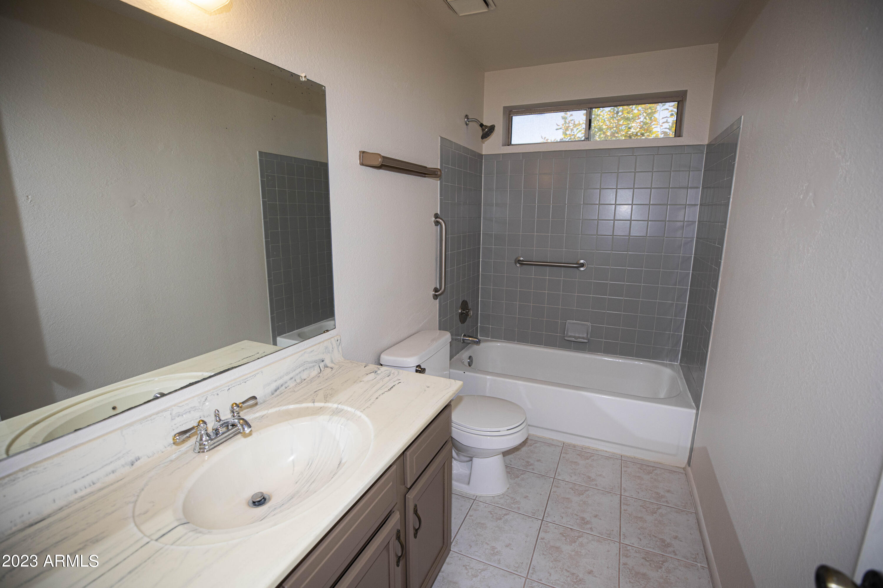 608 East Appaloosa Road Gilbert, AZ 85296 - Photo 19 of 38 a bathroom with a bathtub shower sink mirror and toilet