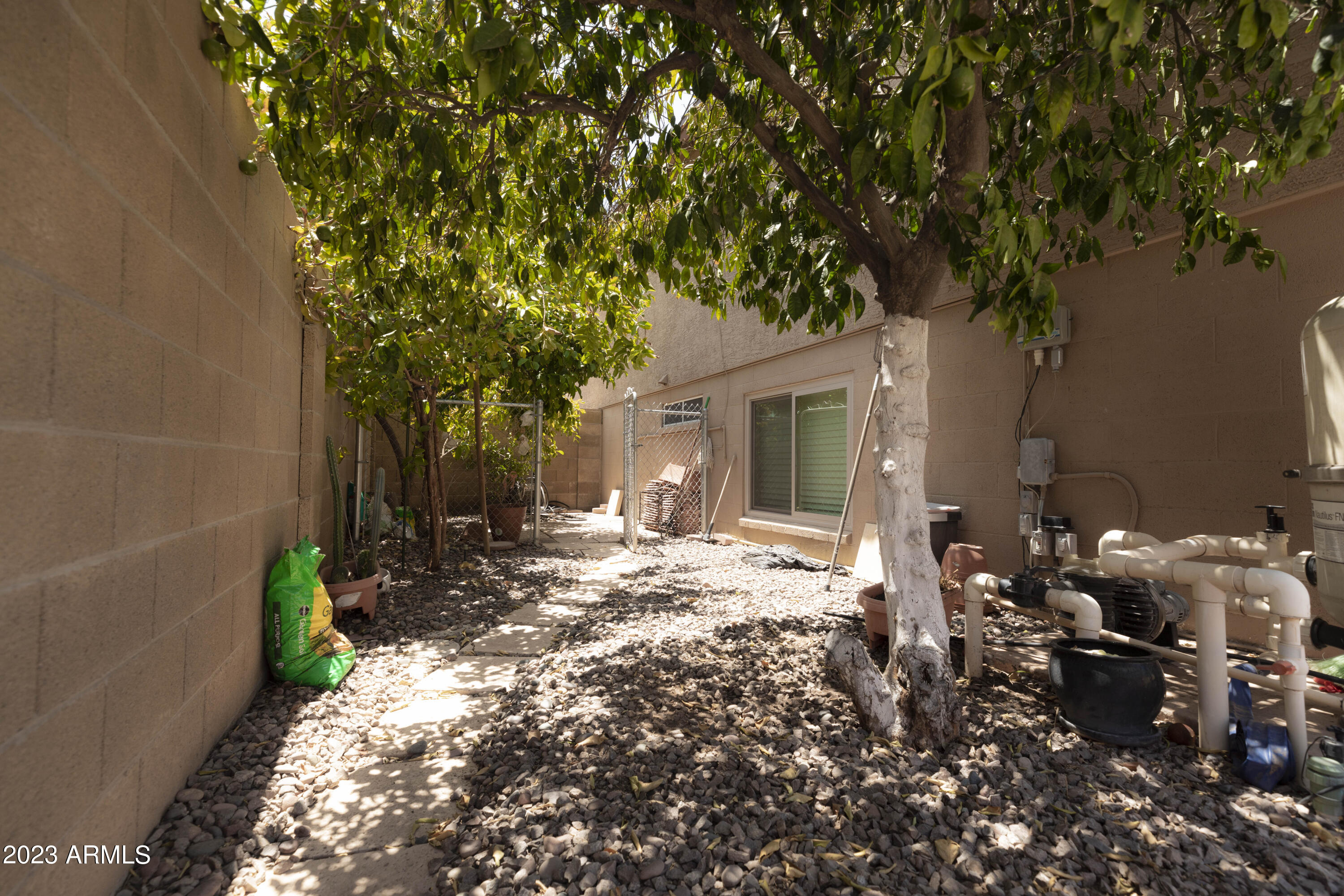 608 East Appaloosa Road Gilbert, AZ 85296 - Photo 27 of 38 a view of a house with backyard sitting area and garden