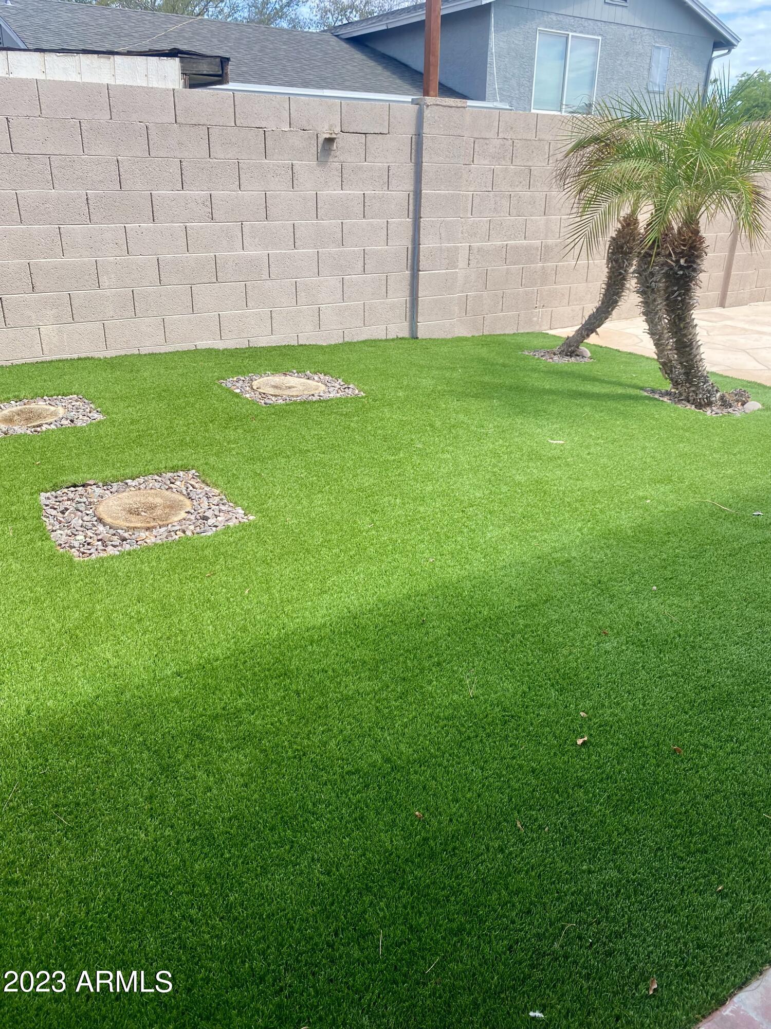 608 East Appaloosa Road Gilbert, AZ 85296 - Photo 33 of 38 a backyard of a house with lots of green space