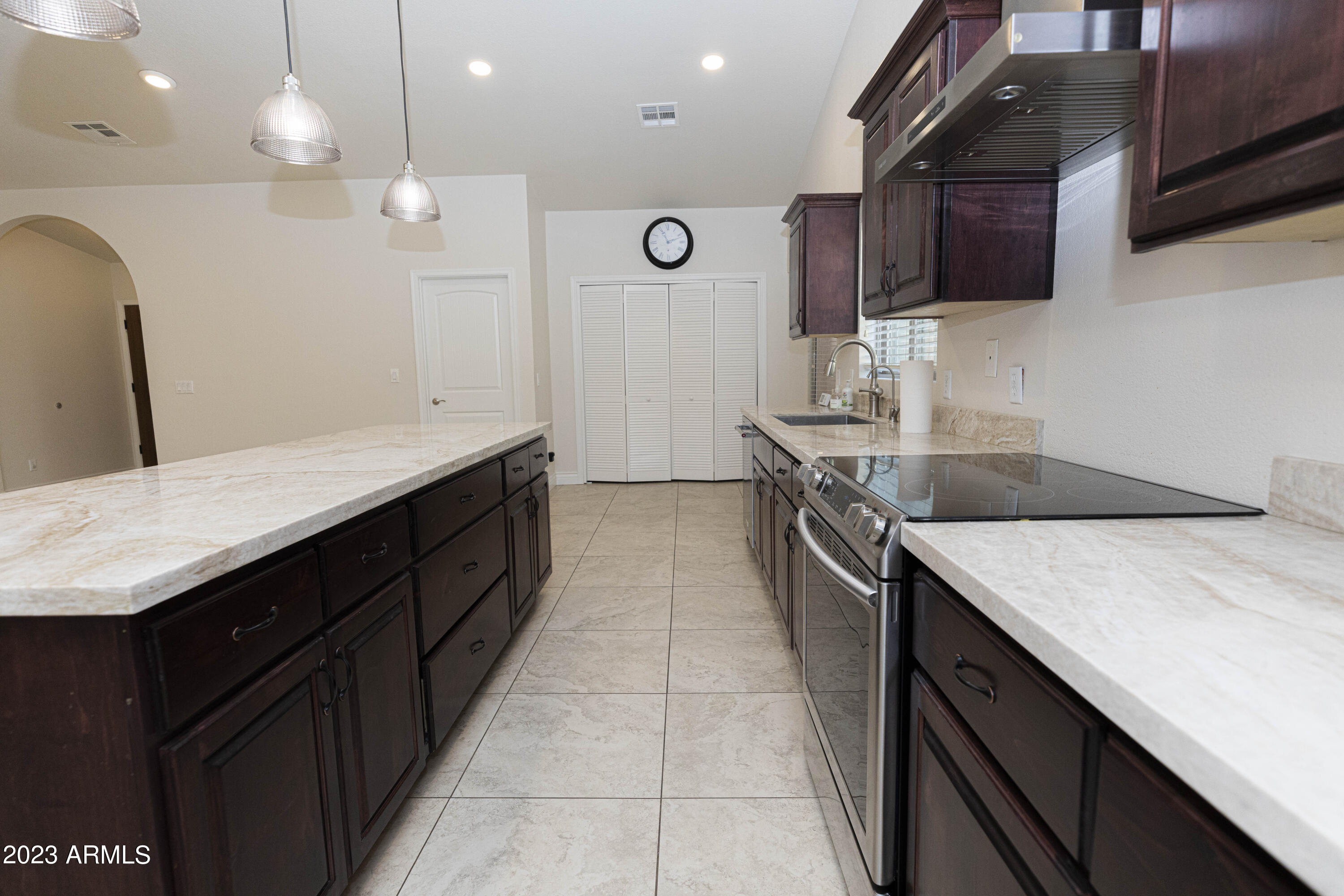 608 East Appaloosa Road Gilbert, AZ 85296 - Photo 8 of 38 a kitchen with a sink a stove oven and wooden floor