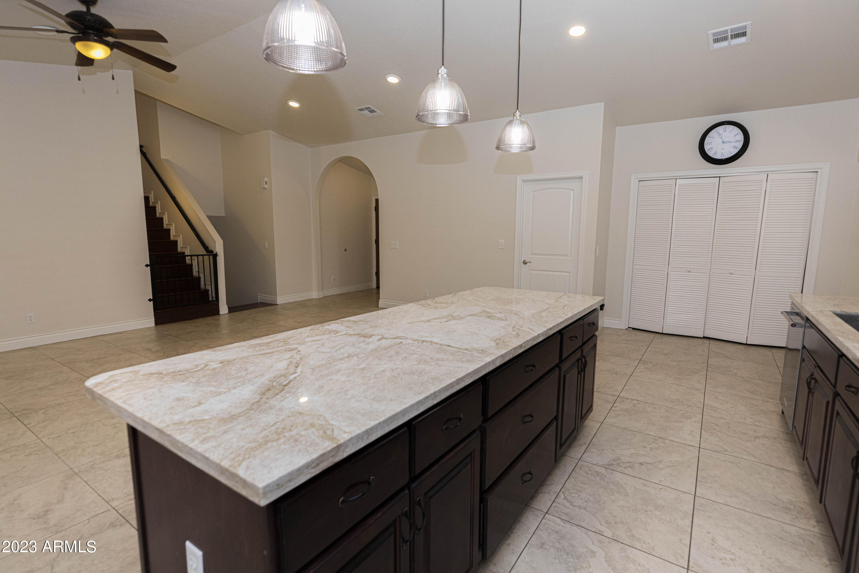 608 East Appaloosa Road Gilbert, AZ 85296 - Photo 9 of 38 a kitchen with a sink a counter space and a chandelier