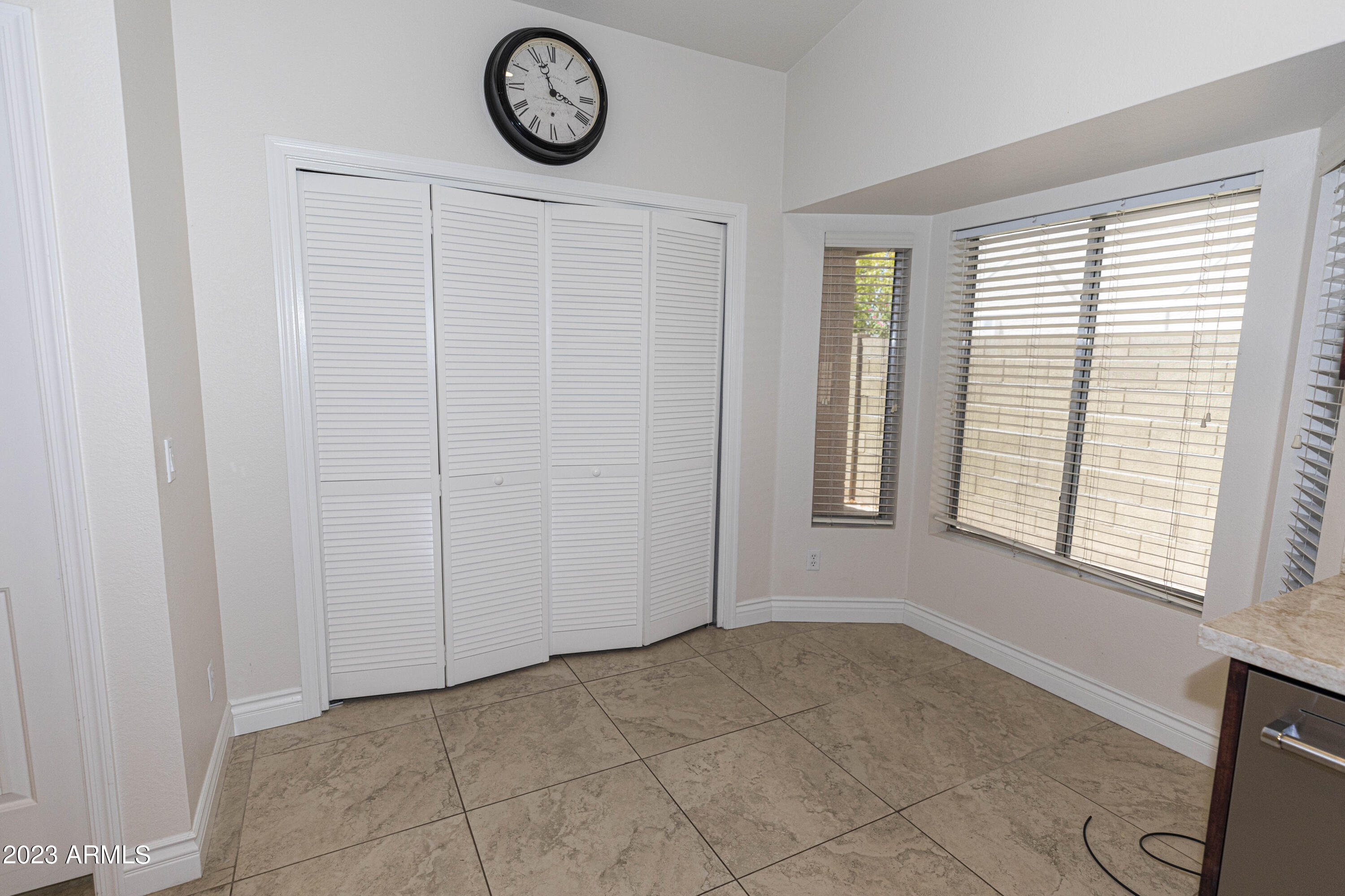 608 East Appaloosa Road Gilbert, AZ 85296 - Photo 10 of 38 a view of an empty room with window and hardwood floor