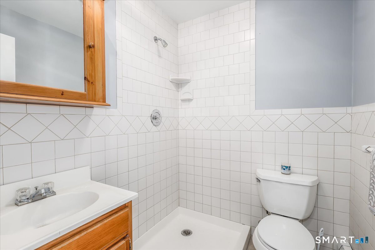 19 Botsford Hill Road Newtown, CT 06470 - Photo 20 of 40 a bathroom with a sink a toilet and shower
