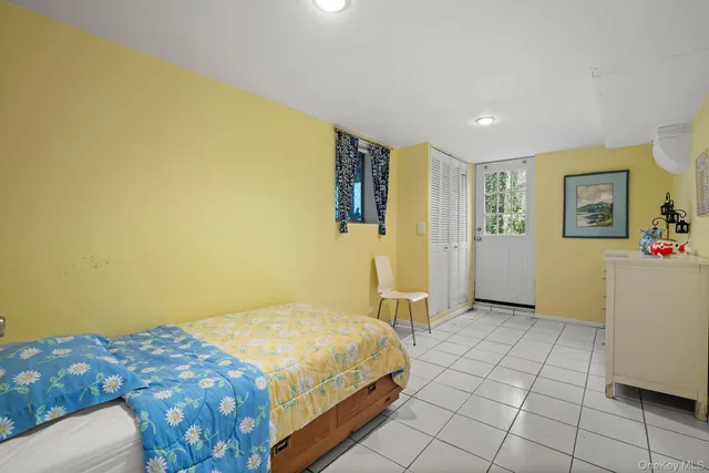 a bedroom with a bed and a view of bathroom