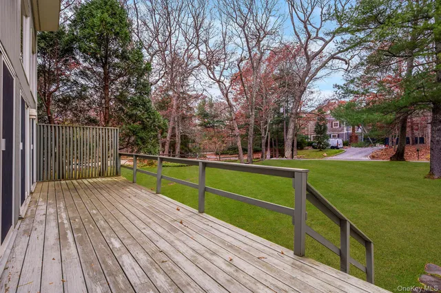 a view of outdoor space with deck and yard