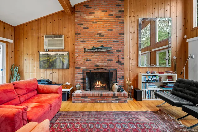 a view of a livingroom with furniture and a fireplace
