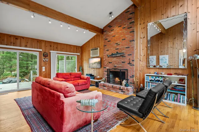 a outdoor living space with furniture and a fireplace