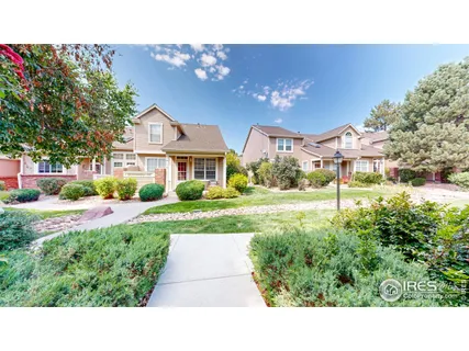 a view of house with yard and green space