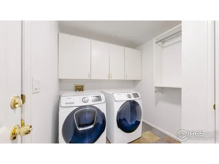 a bathroom with a sink a washer and dryer