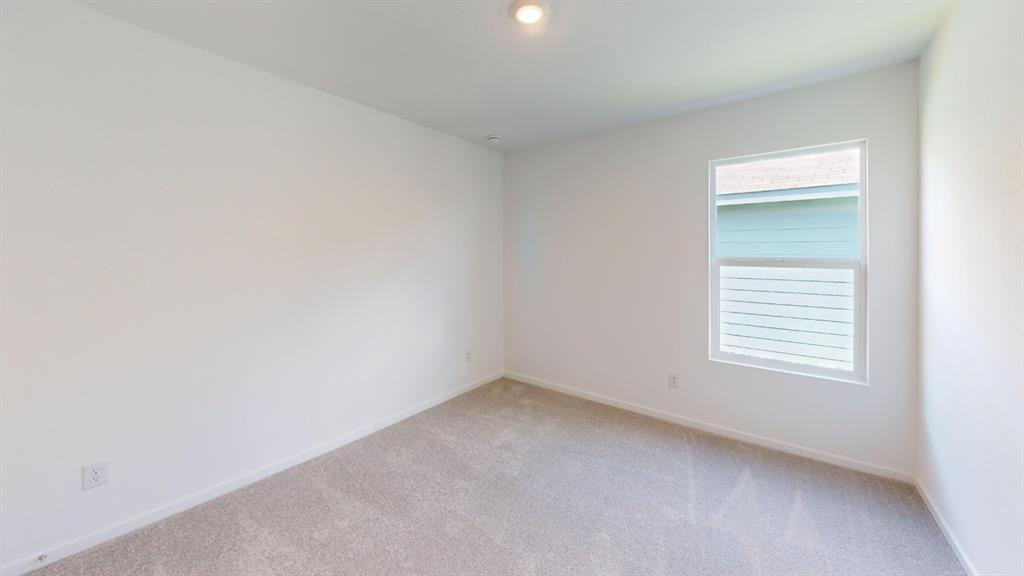 1005 Calley Pear Trail Princeton, TX 75407 - Photo 14 of 20 an empty room with a window