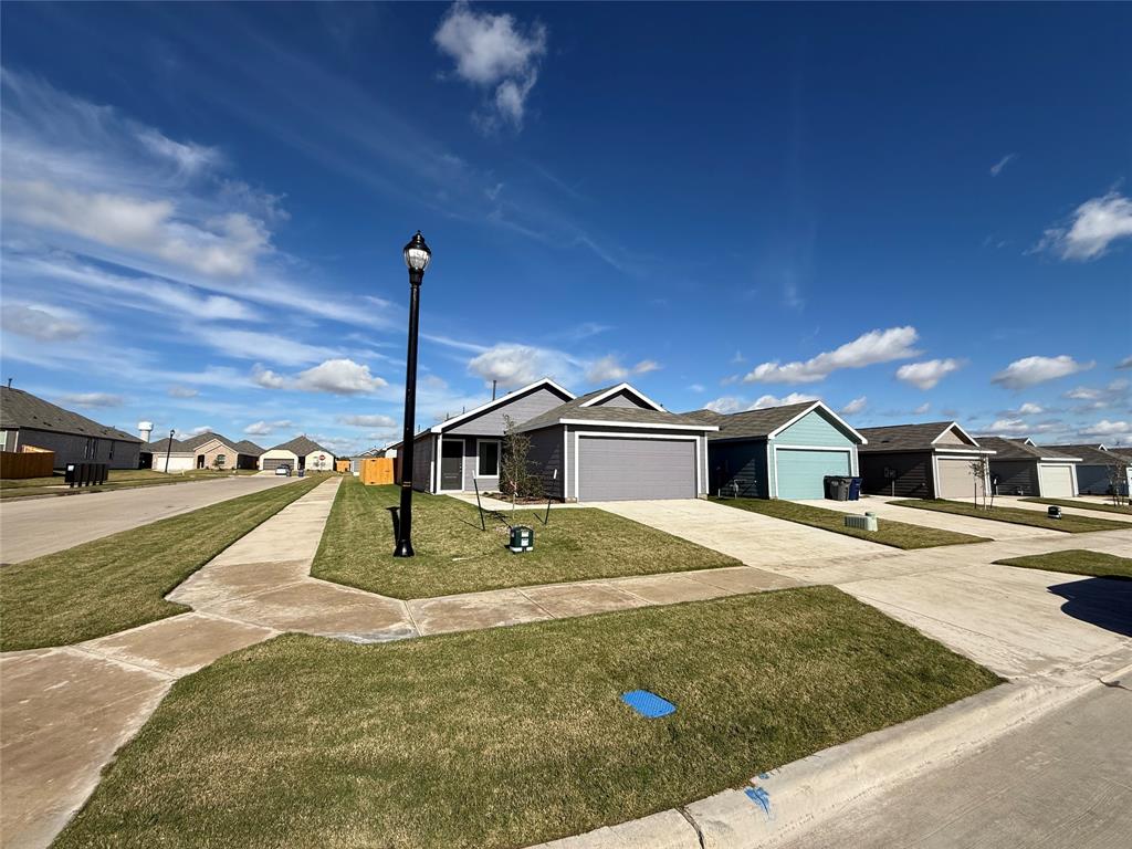 1005 Calley Pear Trail Princeton, TX 75407 - Photo 2 of 20 a view of a house with a yard