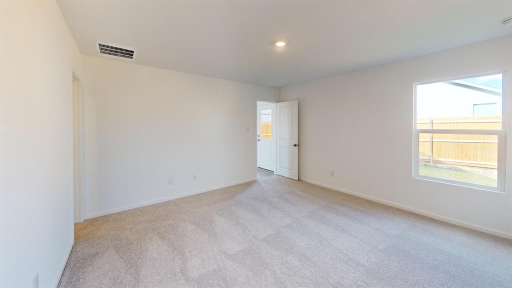 1005 Calley Pear Trail Princeton, TX 75407 - Photo 8 of 20 a view of an empty room with a window