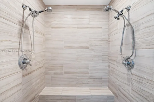 a spacious bathroom with a double vanity sink and a mirror