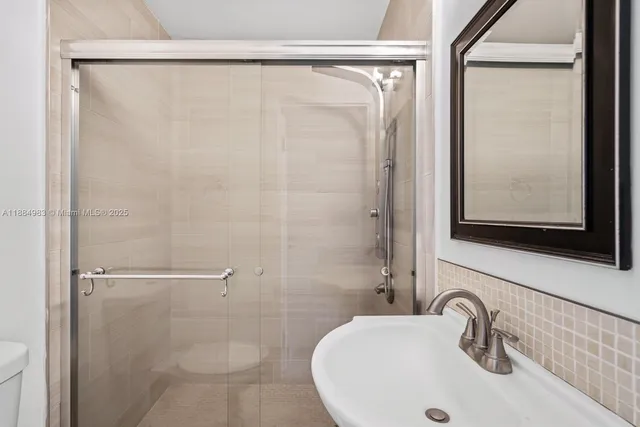 a bathroom with a bathtub and a toilet
