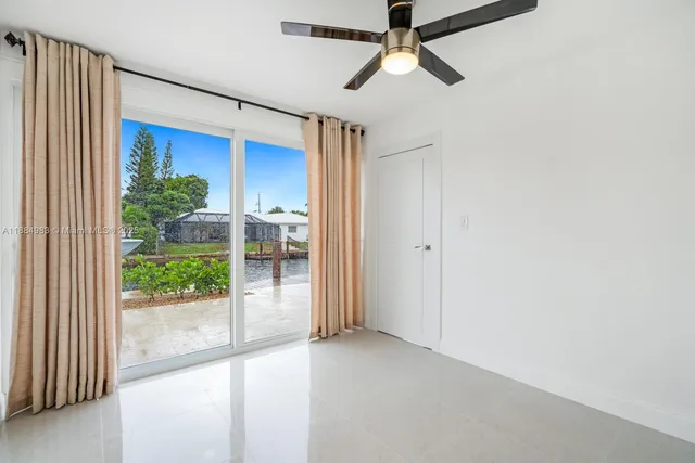 a view of a lake with a house in the background