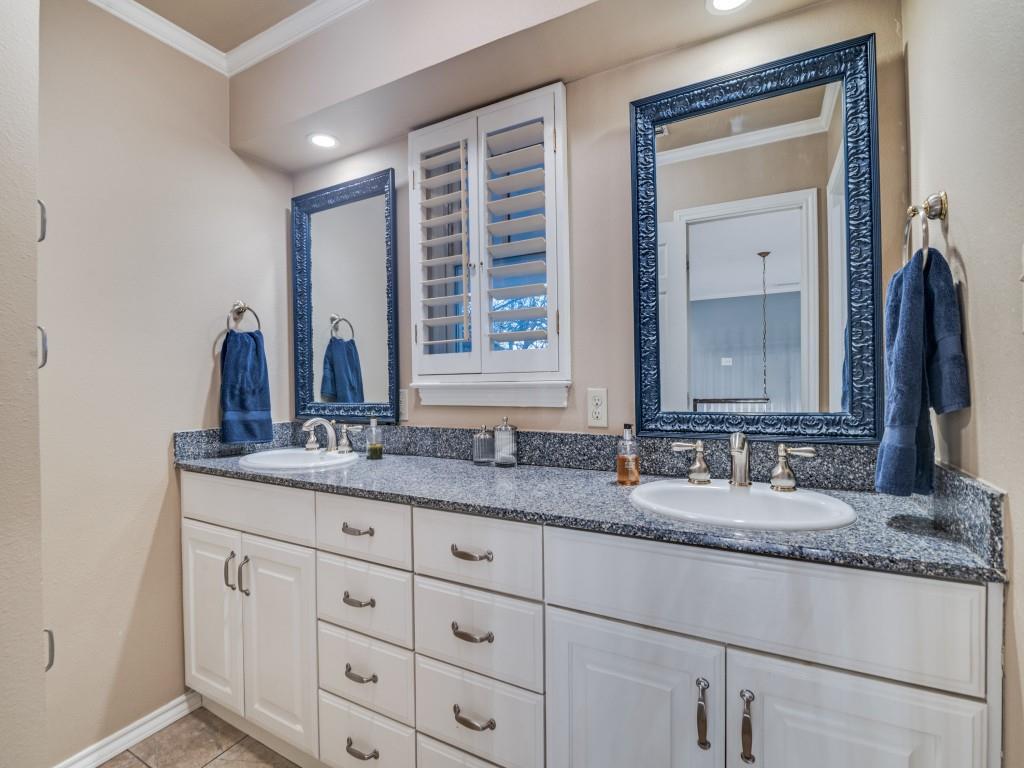 343 East Tripp Road Sunnyvale, TX 75182 - Photo 24 of 36 a bathroom with a granite countertop sink and a mirror