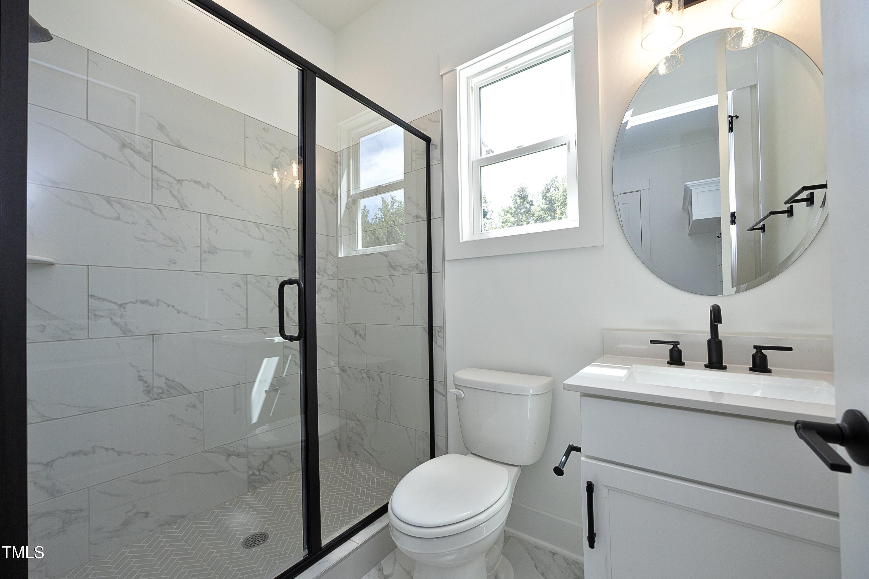 1145 Duke Farm Drive Wake Forest, NC 27587 - Photo 15 of 37 a bathroom with a sink toilet and shower