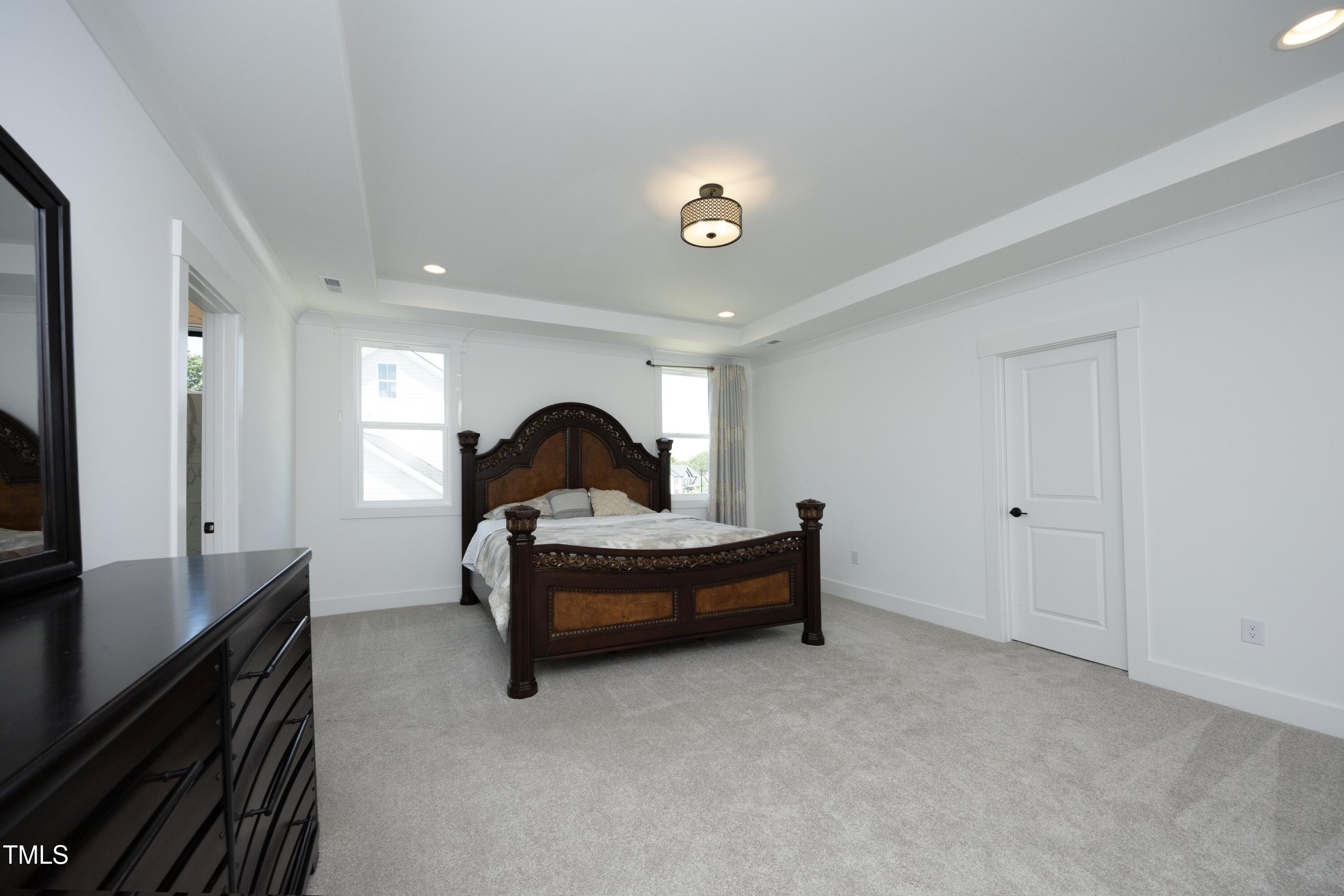 1145 Duke Farm Drive Wake Forest, NC 27587 - Photo 16 of 37 a man sitting on a bench in a room