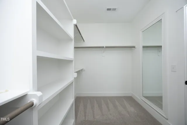 a man sitting on a bench in a room