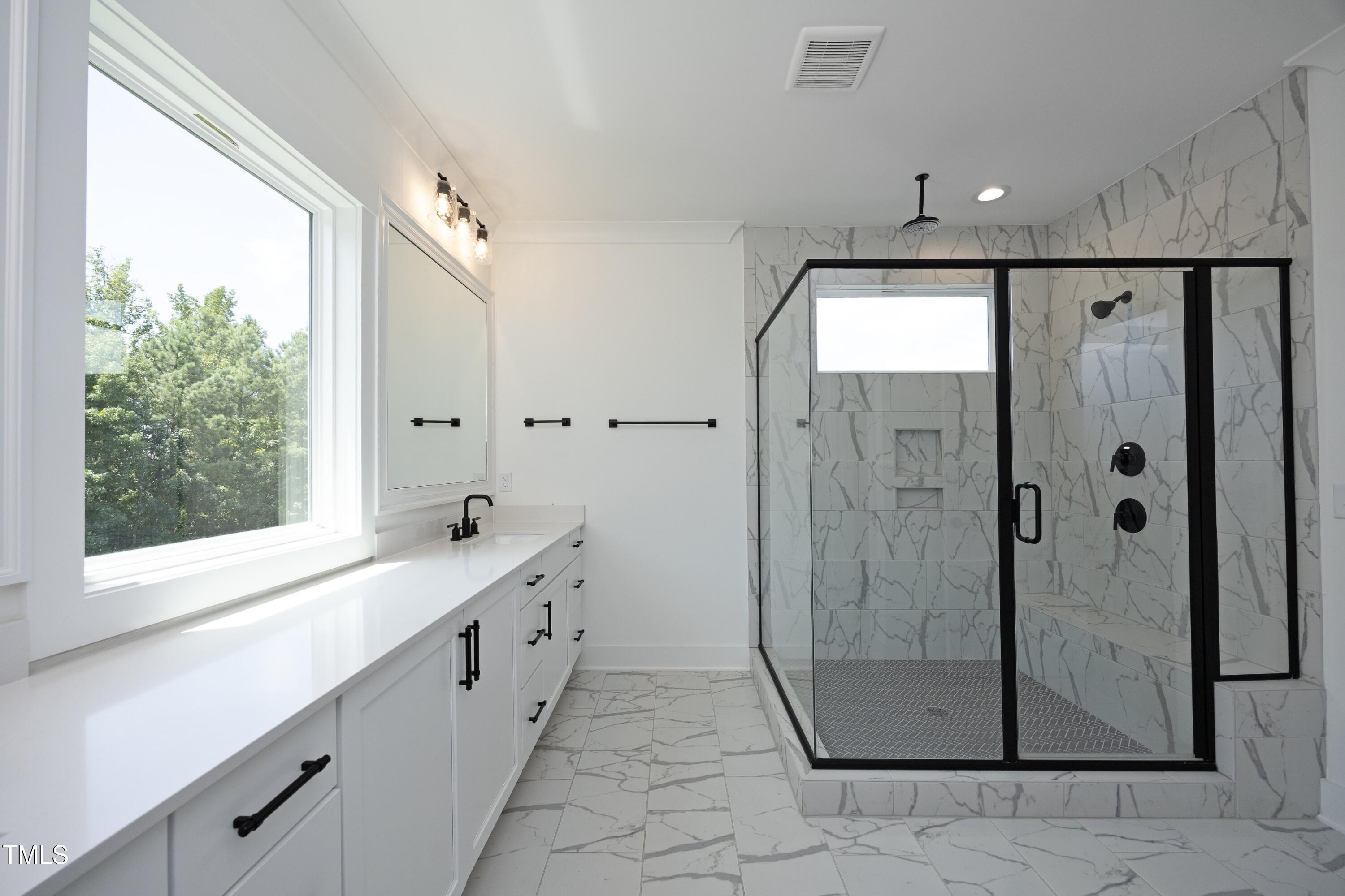 1145 Duke Farm Drive Wake Forest, NC 27587 - Photo 19 of 37 a bathroom with a shower and a sink