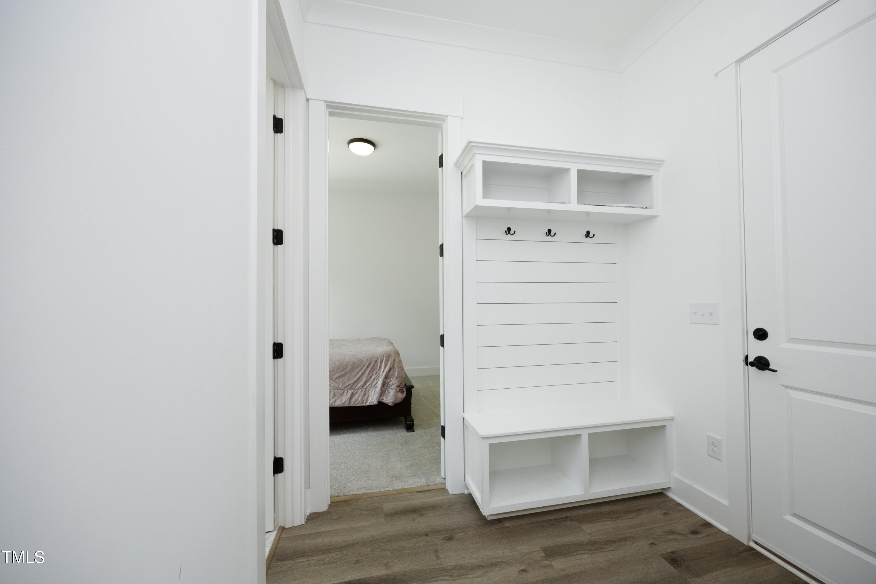 1145 Duke Farm Drive Wake Forest, NC 27587 - Photo 21 of 37 a view of walk in closet with wooden floor