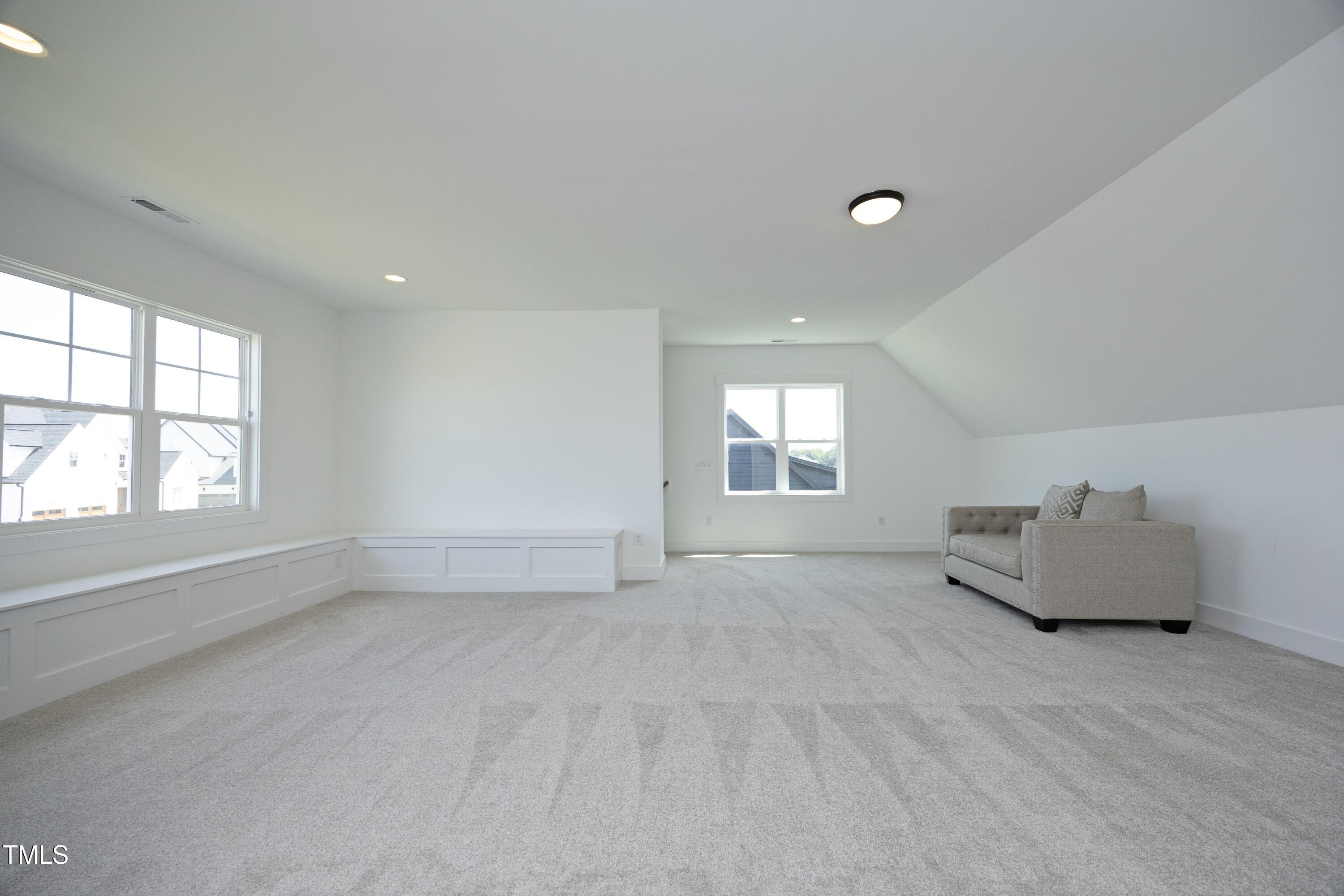 1145 Duke Farm Drive Wake Forest, NC 27587 - Photo 24 of 37 an empty room with windows and cabinet