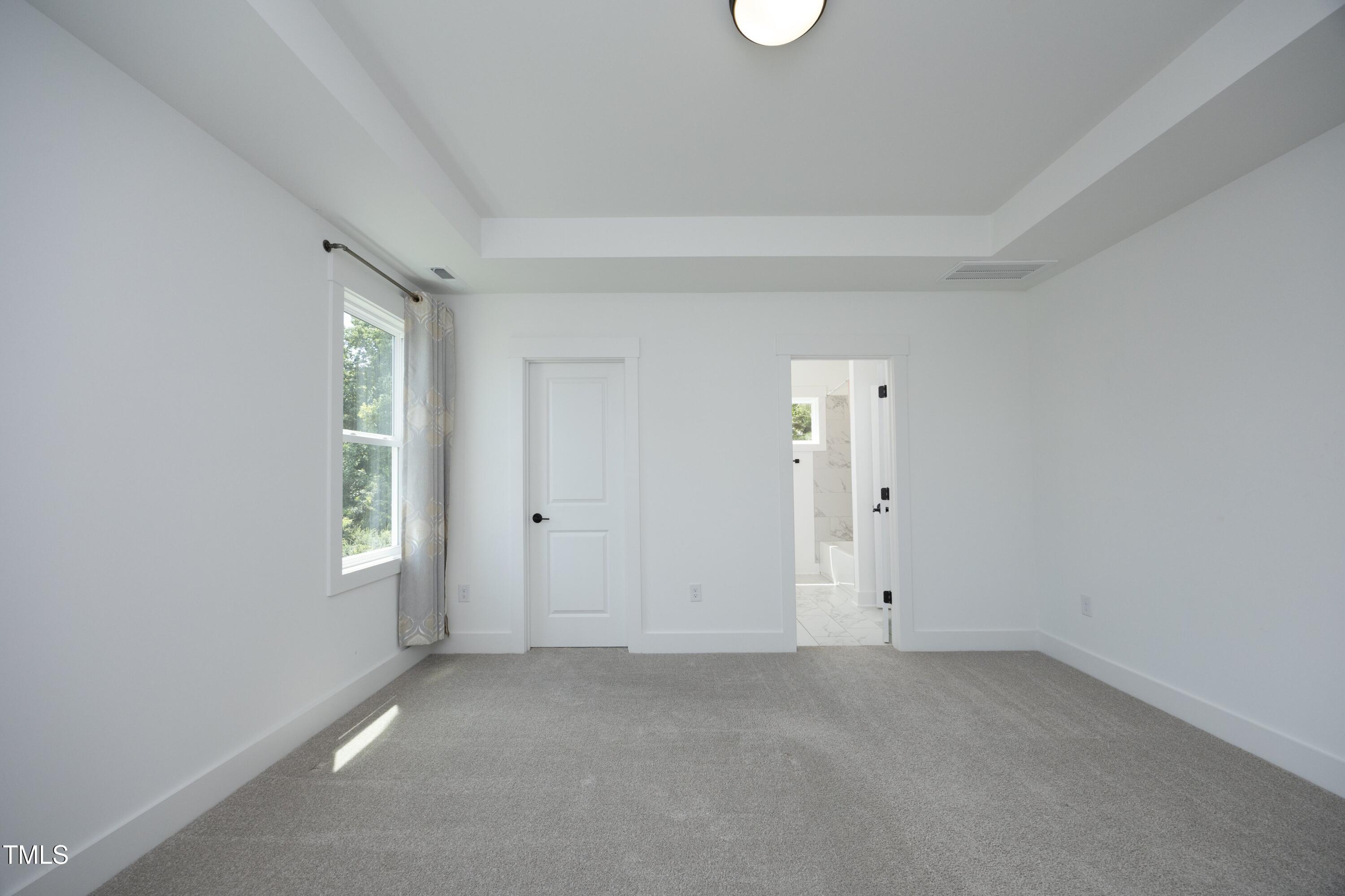 1145 Duke Farm Drive Wake Forest, NC 27587 - Photo 31 of 37 an empty room with windows and closet