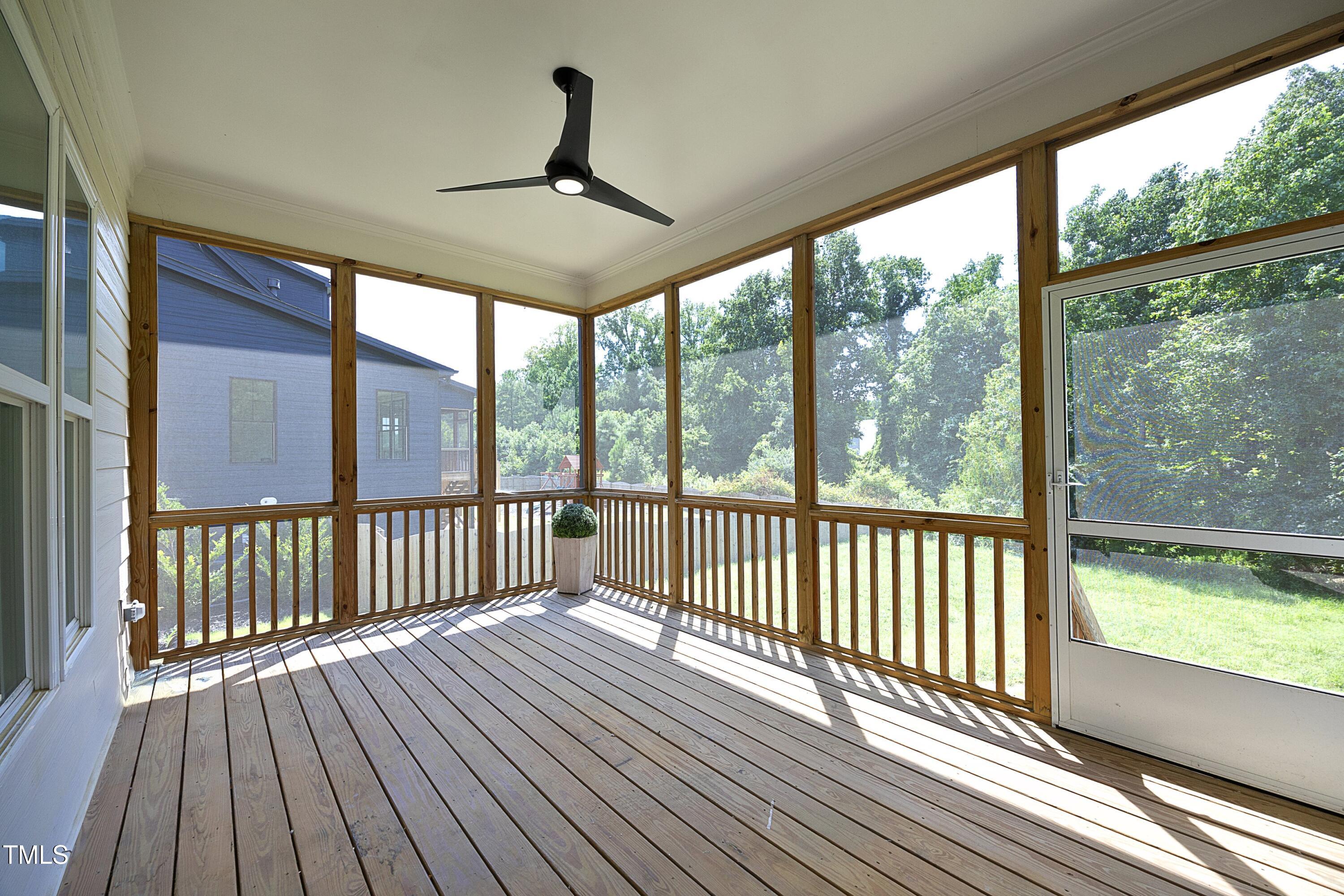 1145 Duke Farm Drive Wake Forest, NC 27587 - Photo 32 of 37 a view of a balcony with wooden floor a ceiling fan and wooden floor