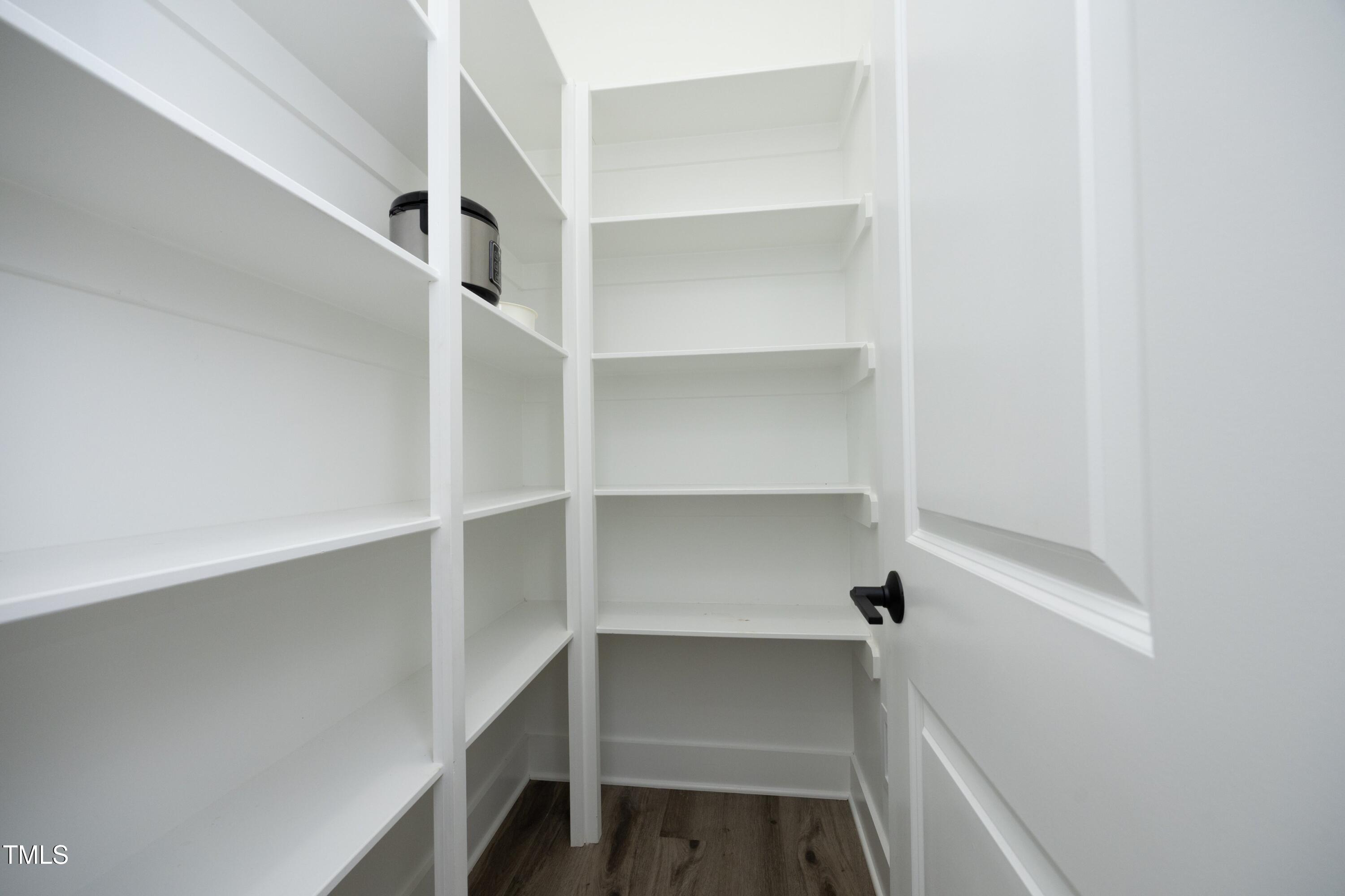 1145 Duke Farm Drive Wake Forest, NC 27587 - Photo 8 of 37 a view of walk in closet with empty racks