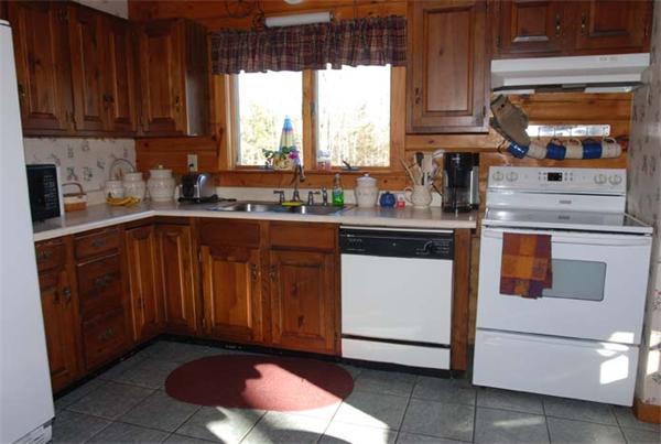 40 Kimball Road Amesbury, MA 01913 - Photo 5 of 24 a kitchen with a sink cabinets appliances and a window