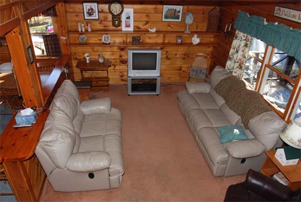 40 Kimball Road Amesbury, MA 01913 - Photo 6 of 24 a living room with furniture a fireplace and a flat screen tv