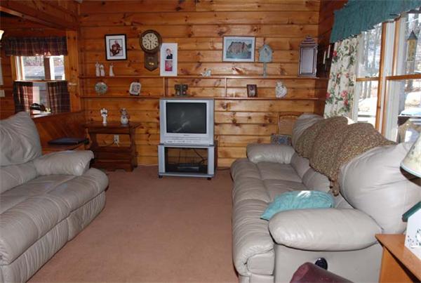 40 Kimball Road Amesbury, MA 01913 - Photo 7 of 24 a living room with furniture a fireplace and a large window