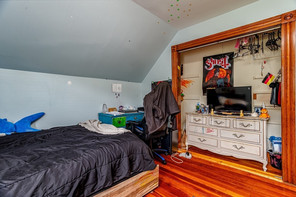 54 Charles Street Gardner, MA 01440 - Photo 25 of 40 a bedroom with a bed and flat screen tv