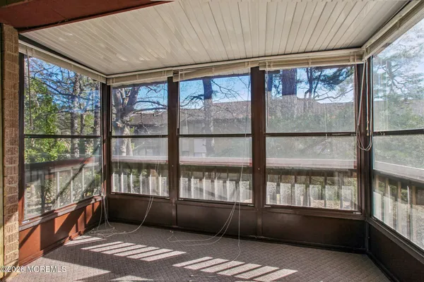 a view of an empty room with a large window