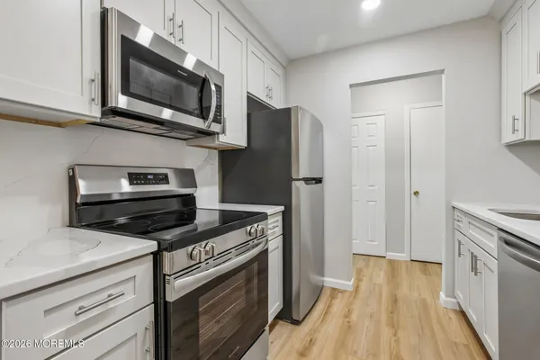 a kitchen with a stove and a microwave