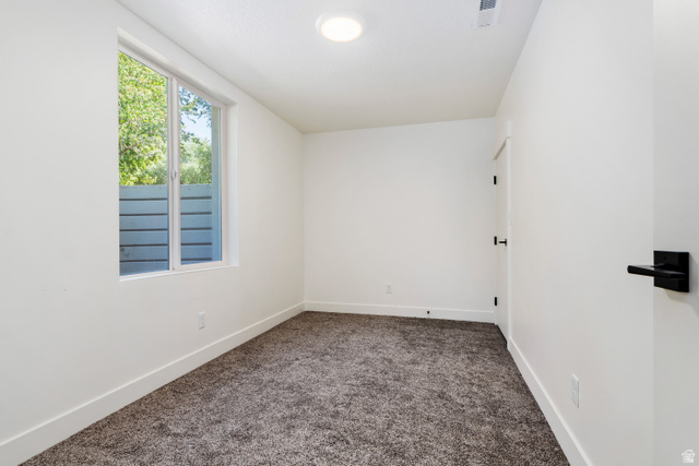 504 North 650 E Street Springville, UT 84663 - Photo 34 of 36 Room featuring light-colored walls and dark textured carpeting